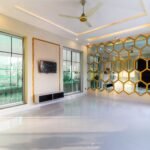 A luxurious modern interior with honeycomb mirrors, large windows, and sleek design.