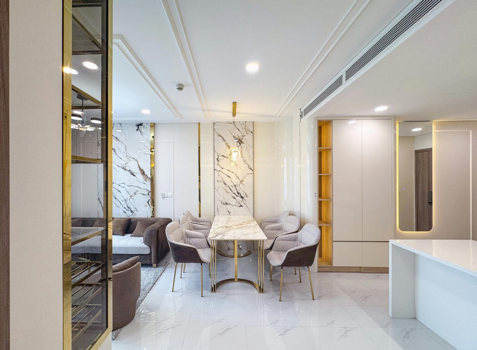 Elegant indoor dining area featuring marble elements and plush seating in a contemporary style.