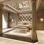 Elegant bedroom featuring classic furnishings, gold accents, and dramatic lighting.