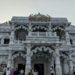 Explore the intricate architectural beauty of Prem Mandir in Vrindavan at twilight.