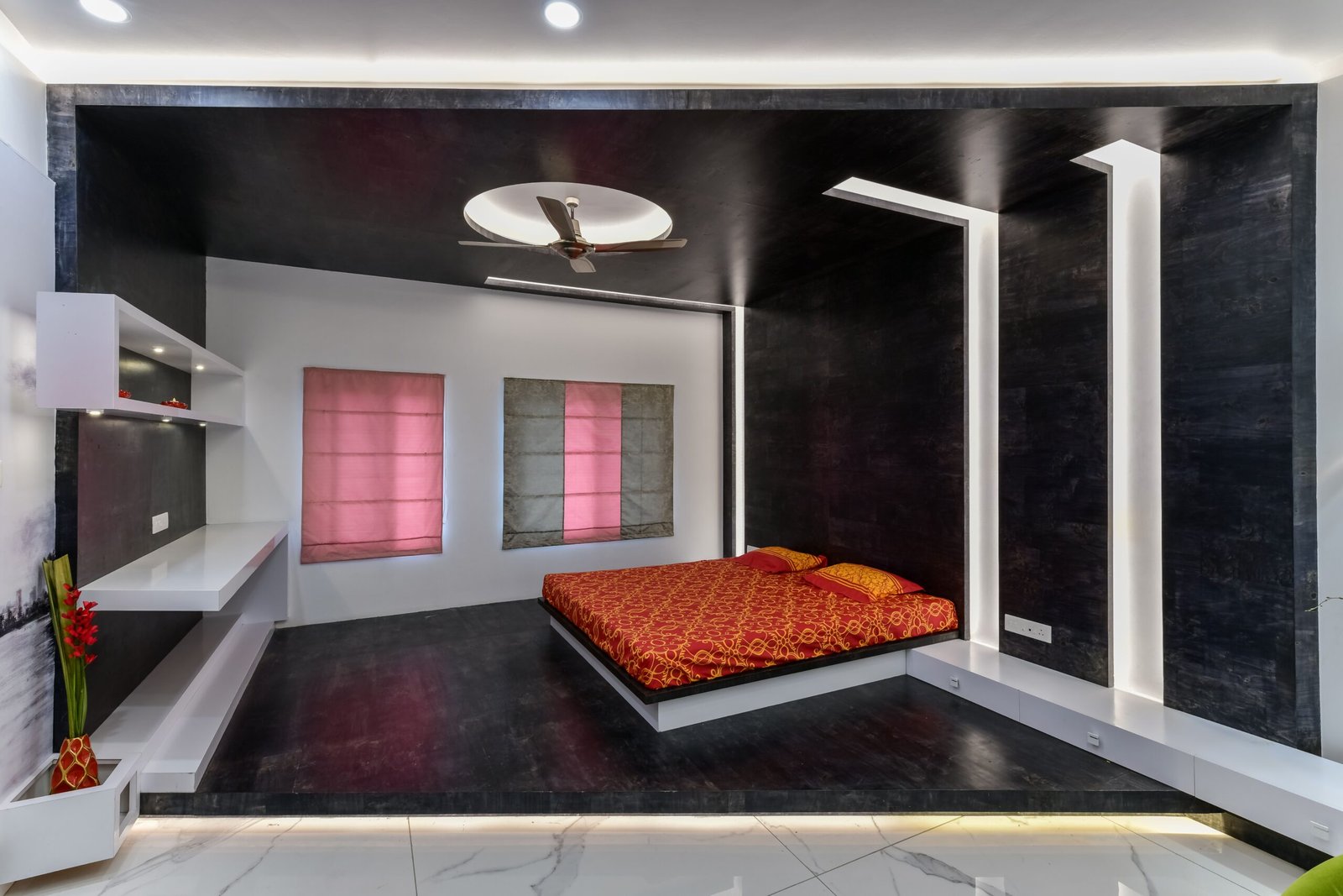 Luxurious and minimalist bedroom interior with bold design and stylish lighting.